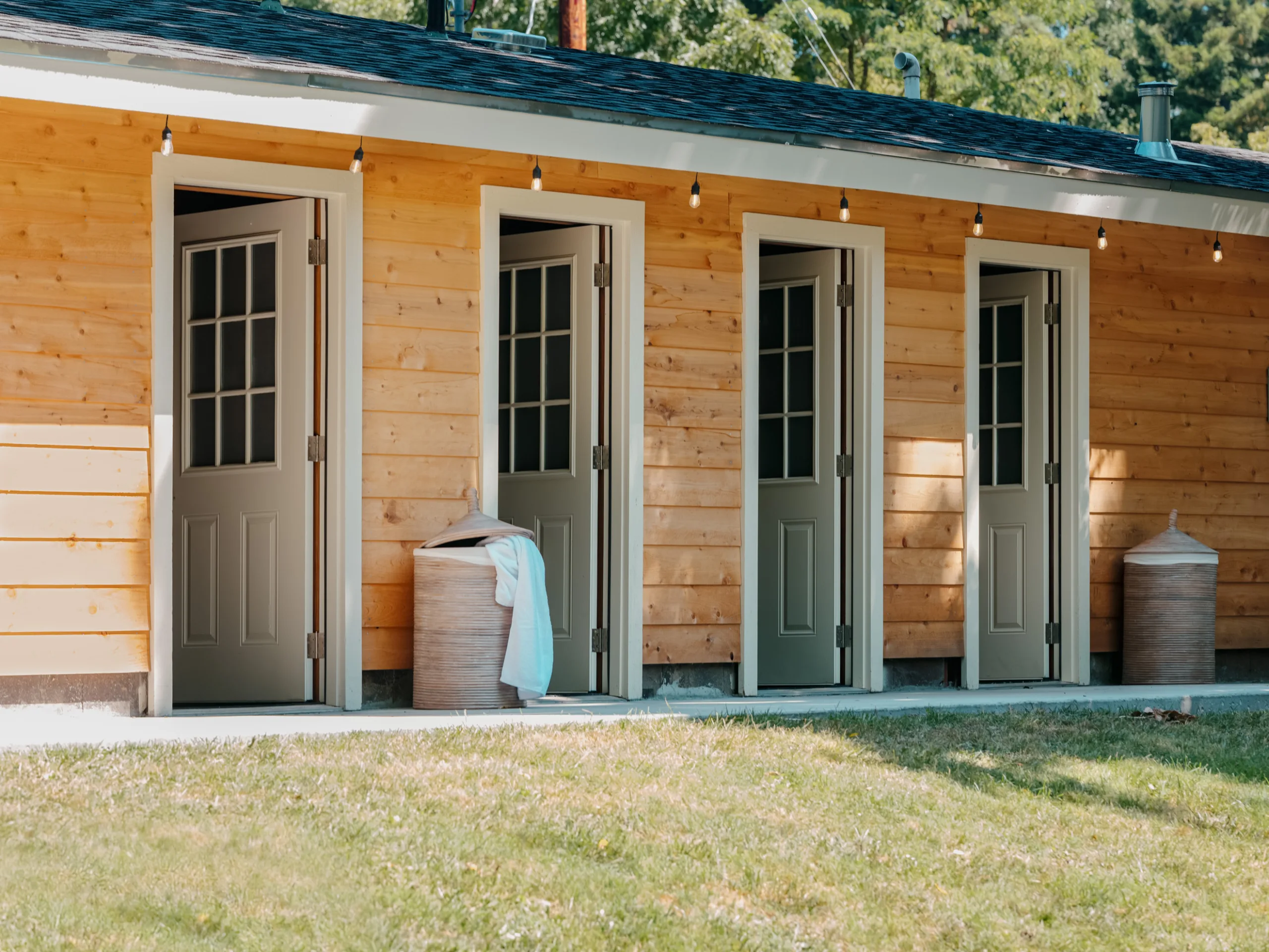 Bathhouse at Dawn Ranch Glamping tent showing bedding